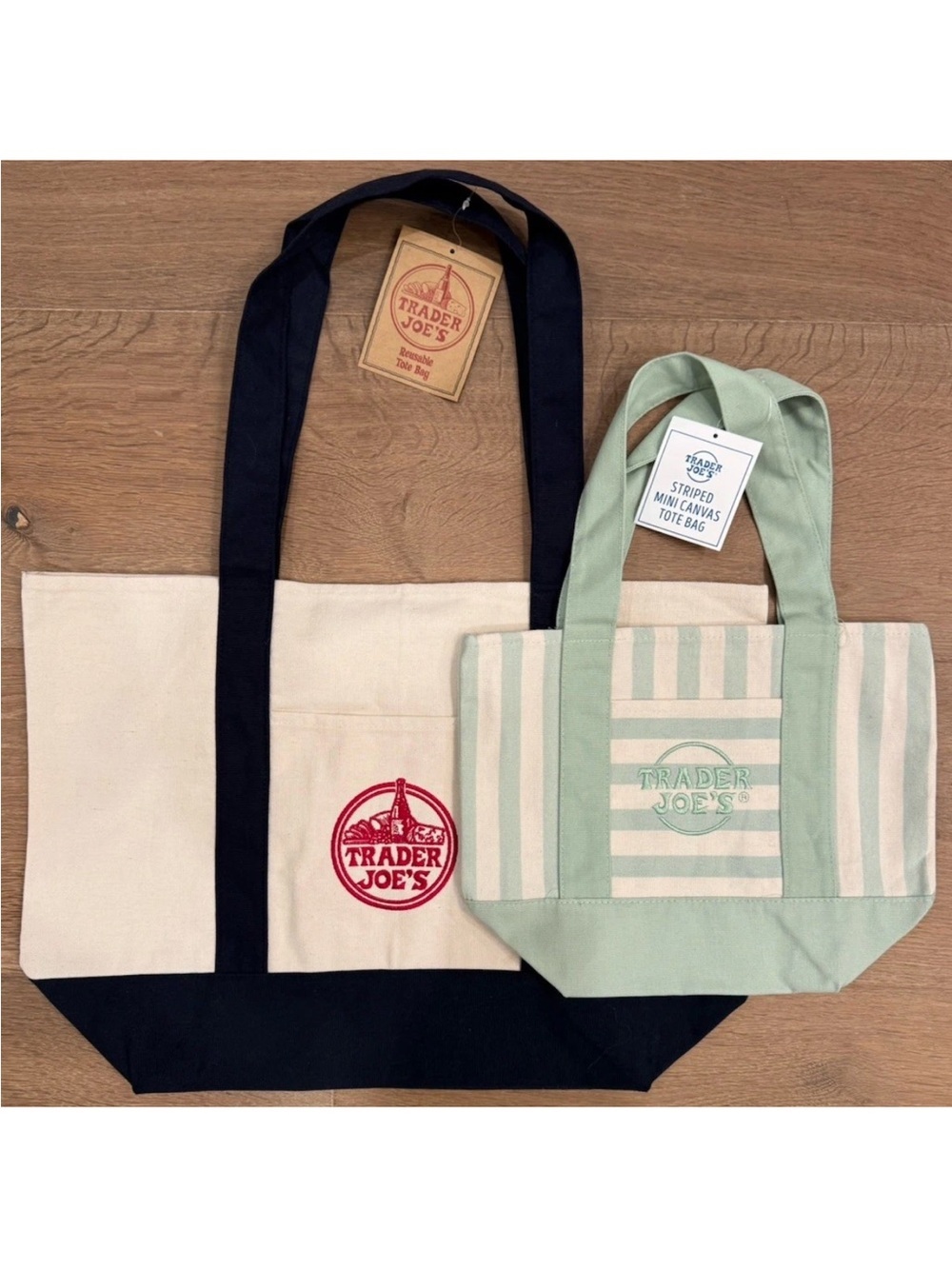 Two limited edition Trader Joe’s bags. One large w navy. One mini stripe green
